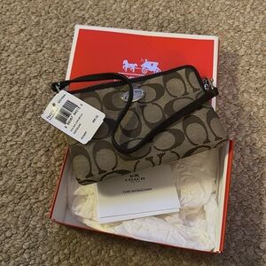 Small brown coach wristlet